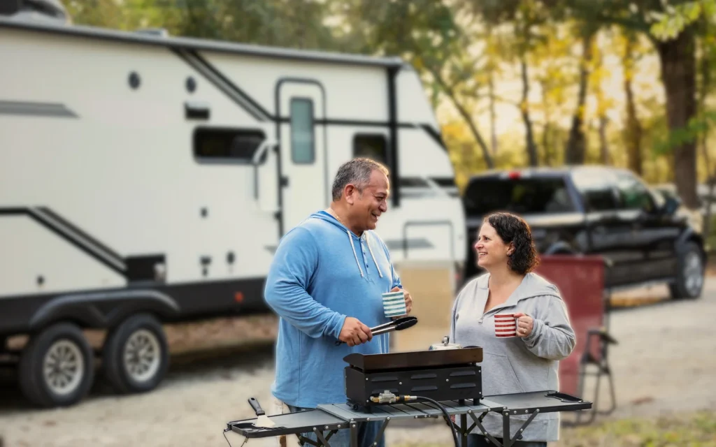 RV-owners-mold-inspection RV owners aving a BBQ outside their RV after a mold inspection
